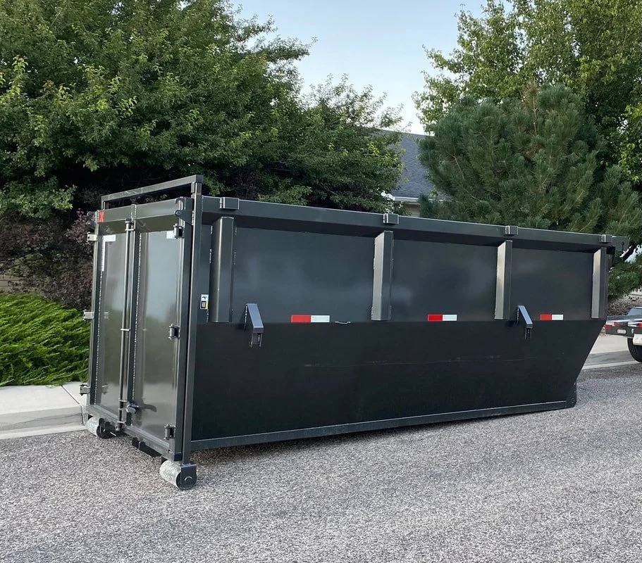 Longhorn roll off dumpster on a residential driveway for a cleanout